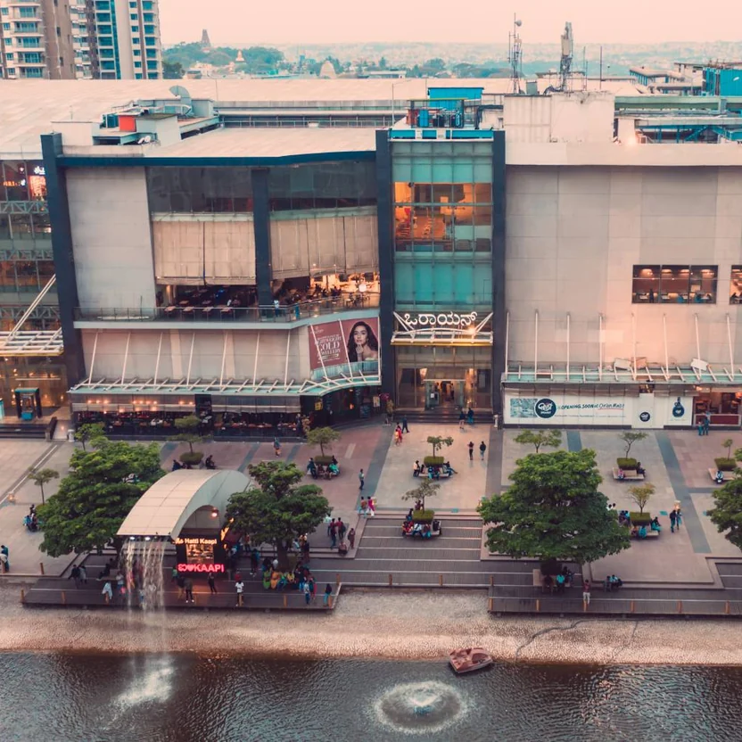Orion Mall at Brigade Gateway beside its lake, aerial photograph